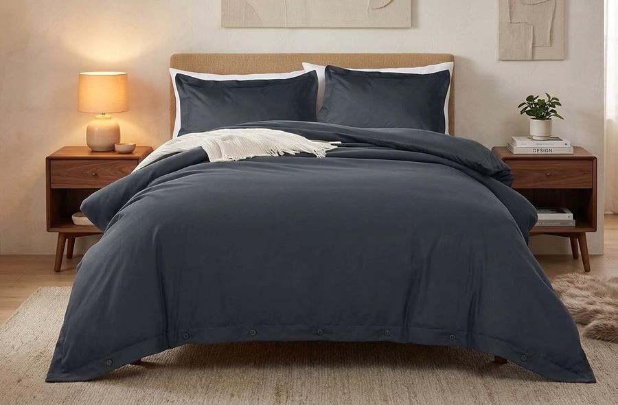 Charcoal King duvet cover with corner ties on a made bed